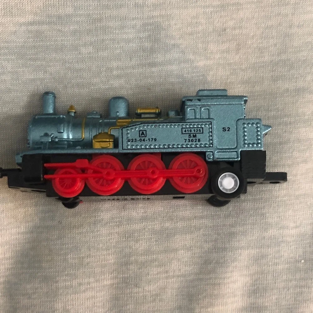Blue and Red Toy Train with Gold Accents